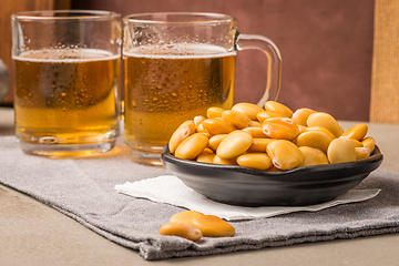 Image showing Tasty lupins and glass of beer