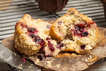 Image showing Muffins with red fruits jam fill.