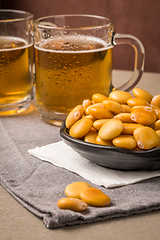 Image showing Tasty lupins and glass of beer