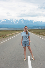 Image showing Woman sitting on the road