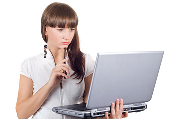 Image showing Young businesswoman with phone and laptop over white