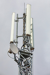 Image showing Wireless communication tower with antenna