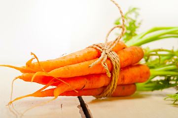 Image showing baby carrots bunch tied with rope