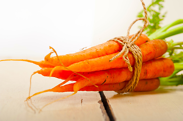 Image showing baby carrots bunch tied with rope