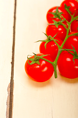 Image showing fresh cherry tomatoes on a cluster