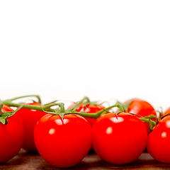 Image showing fresh cherry tomatoes on a cluster