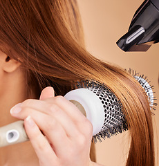 Image showing Hair, closeup and woman with hairdryer in studio for beauty, blowing and styling on brown background. Zoom, haircare and girl with salon treatment, hairstyle and hairdressing appliance isolated