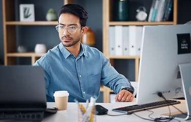 Image showing Serious, laptop and business man in office for startup management, digital planning and trading. Focused male worker at computer technology for online project, website and internet research at table