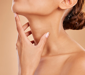 Image showing Skincare, beauty and neck of a woman with a glow isolated on a brown background in a studio. Wellness, health and a girl feeling and touching skin for satisfaction, grooming and care for anti aging