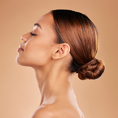 Image showing Beauty, face and a woman profile for skin glow and shine in studio on brown background. Aesthetic female model satisfied with spa facial, dermatology cosmetic and wellness with skincare or self care