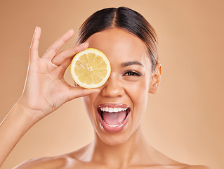 Image showing Lemon, skincare and face of woman with excited smile in studio for wellness, facial treatment and natural cosmetics. Beauty, spa and happy girl with fruit slice for detox, vitamin c and dermatology