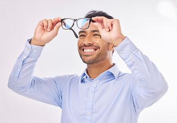 Image showing Glasses, vision and man happy in studio for eye care, lens or frame isolated on a white background. Smile of excited asian male model face with optometry eyewear in hands to check eyesight or focus