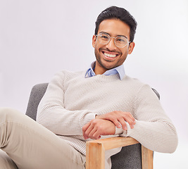 Image showing Vision, chair and portrait of businessman for optometry sitting happy with a smile and confident isolated in studio white background. Glasses on face of professional male employee or entrepreneur