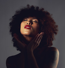 Image showing Black woman, shadow and makeup or red lipstick with beauty, afro or natural hair in studio. Face of aesthetic female model with hands to show skin glow, shine and color on lips for art and skincare