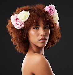 Image showing Face, beauty and flowers with a model black woman in studio on a dark background for natural skincare. Wellness, luxury and portrait with an attractive young female wearing a flower crown or wreath