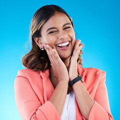 Image showing Excited, hands on face and portrait of woman in studio with surprise, good news and happiness expression. Wow, emoji reaction and Indian girl for success, celebration and happy on blue background