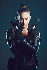 Image showing Woman, gun and assassin in studio portrait for costume, action or cyberpunk clothes. Girl, pistol and leather fashion for crime, gangster and futuristic spy with danger or future aesthetic with ninja