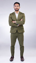 Image showing Serious, business man and portrait of arms crossed in studio, white background and professional worker. Focused entrepreneur, male model and leadership in suit, corporate power and assertive attitude