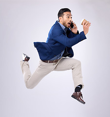 Image showing Phone call, rush and late with a business man on white background in studio running to an appointment. Conversation, coffee and hurry with a male employee sprinting fast to keep a schedule