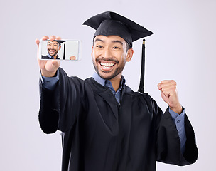 Image showing Asian man, selfie and smile for graduation, scholarship or diploma against a white studio background. Happy male graduate smiling for profile picture, vlog or photo in memory of milestone achievement