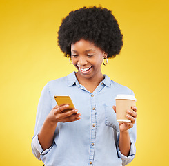 Image showing Happy, phone and black woman with coffee in studio, texting and laughing against yellow background. Smartphone, message and female with tea while browsing social media, app or online dating website