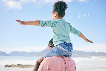 Image showing Beach, black man with child on shoulders in nature on playful family holiday in Australia with freedom and energy. Travel, happy father and girl playing, flying and bonding together on fun vacation