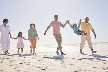 Image showing Family walk beach, freedom and travel, generations and happy people, grandparents with parents and kids. Adventure, outdoor with dad and grandfather swing kid, fun on holiday with hand holding