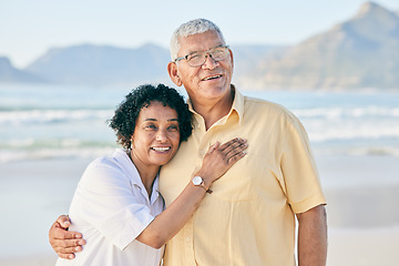 Image showing Senior couple at beach, hug and smile with travel, retirement and love outdoor, vacation with view and relax in nature. Peace, zen and tropical island, man and woman with marriage and happiness