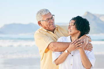 Image showing Senior couple at beach, hug and happy with travel, retirement and love outdoor, vacation with view and relax in nature. Peace, zen and tropical island, man and woman with marriage and happiness