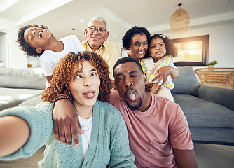 Image showing Comic, selfie and grandparents with parents and children in living room to relax, bonding and quality time. Love, home and photo portrait of happy family and kids smile, funny face and laugh together