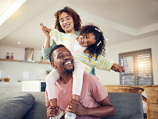 Image showing Black family, father and daughter playing with mother on living room sofa together for fun bonding at home. Happy dad carrying child for piggyback ride with mom on lounge couch enjoying holiday break