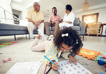 Image showing Child, coloring homework and pencil art of a girl lying on a living room carpet with family at home. House, learning and creative development activity of young kid in kindergarten with a school book