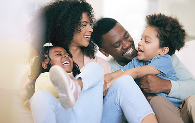 Image showing Happy family, laugh and relax on a sofa, bonding and playing in their home together. Laughter, smile and children with parents on a couch, cheerful and enjoy game, moment and weekend in a living room