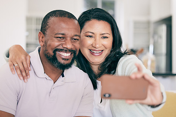 Image showing Senior black couple, selfie and smile in home together for hug, social media or relax for memory for love. Mature man, woman and digital photography app in house for embrace, bonding or happy support