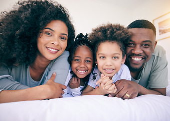 Image showing Black family smile, happiness and portrait of a mother, father and girl children on a house bed. Bedroom, home and happy kids with parent love and support from mama and dad together in the morning