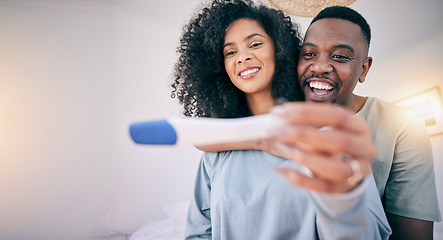 Image showing Pregnancy test, woman hands and happy black couple in a home with a smile from baby news. Support, care and marriage of a young and new mother and dad together feeling love with pregnant female