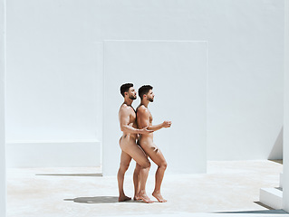 Image showing Art, creativity and naked men together in pose, embrace and sun in Greek architecture, photography and lgbt love. Creative pride aesthetic, artistic passion and nude gay couple with athletic body.