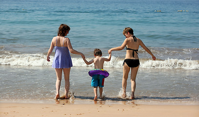 Image showing Two women and a baby