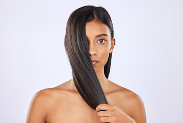 Image showing Woman, hair and beauty and haircare with cosmetics, keratin treatment and portrait on studio background. Serious, Indian female with straight hairstyle and skin glow, Brazilian and cosmetic care