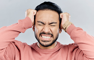 Image showing Man, face and frustrated with stress headache, anxiety and mental health isolated on studio background. Male with eyes closed, depression and distress, person in pain with migraine and burnout