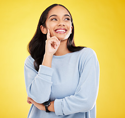 Image showing Yellow background, thinking and face of woman with smile for advertising, promotion and mockup space. Ideas, thoughtful and isolated girl in studio with happy mindset, positive attitude and confident