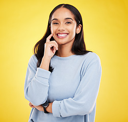 Image showing Yellow background, thinking and portrait of woman with smile for advertising, promotion and mockup space. Ideas, thoughtful and isolated girl in studio with happy mindset, positive and confidence