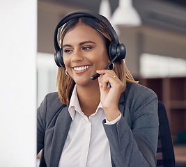 Image showing Call center, indian woman and smile at office computer in business, microphone and tech support and happiness. Telemarketing consultant, desktop pc and female crm with communication for customer care