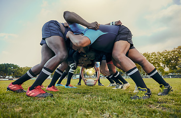 Image showing Rugby fitness, scrum or men training in stadium on grass field in match, practice or sports game. Teamwork, ball or strong athletes in tackle exercise, performance or workout in group competition