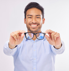 Image showing Glasses, happy man portrait and studio with a optometrist showing an eye wear product. Smile, happiness and frame choice sale of a male model with lens check and optometry with blurred background