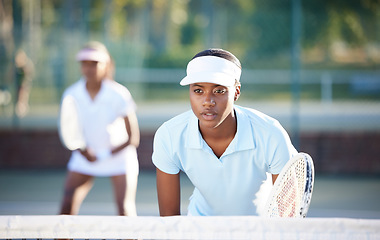 Image showing Tennis, sport and serious black woman on outdoor court, train and fitness, collaboration and ready for game. Exercise, workout and female wait for serve, determined athlete and workout with racket