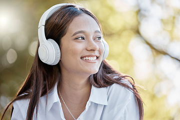 Image showing Headphones, music and woman in nature streaming podcast or radio. Thinking, smile or happy young female with idea, listening or enjoying audio album, song or sound track outdoors in park with headset