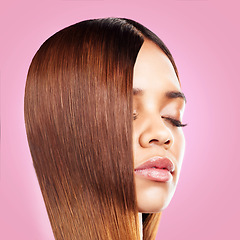 Image showing Beauty, hair and face of black woman with eyes closed isolated in studio with pink background for salon advertising. Haircare, straightener and Brazilian hairstyle on model for growth product promo.