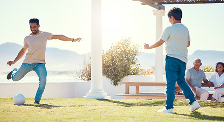 Image showing Soccer, kick and father and son in home garden for learning, bonding or fitness with sports. Relax, training and football with man playing with child in backyard for summer break, weekend or teaching