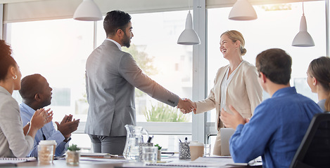 Image showing Business team, handshake and people in meeting for deal, b2b collaboration and congratulations. Man and a woman shaking hands with applause, thank you and corporate partnership achievement in office